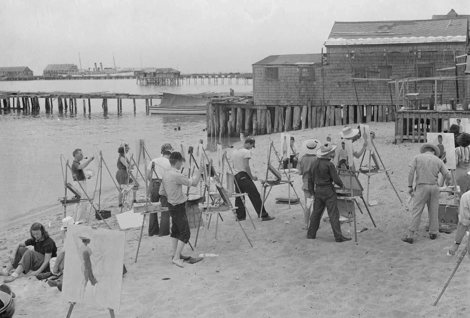 Group of artists painting on the shore of Provincetown, MA — all with Gloucester easels.