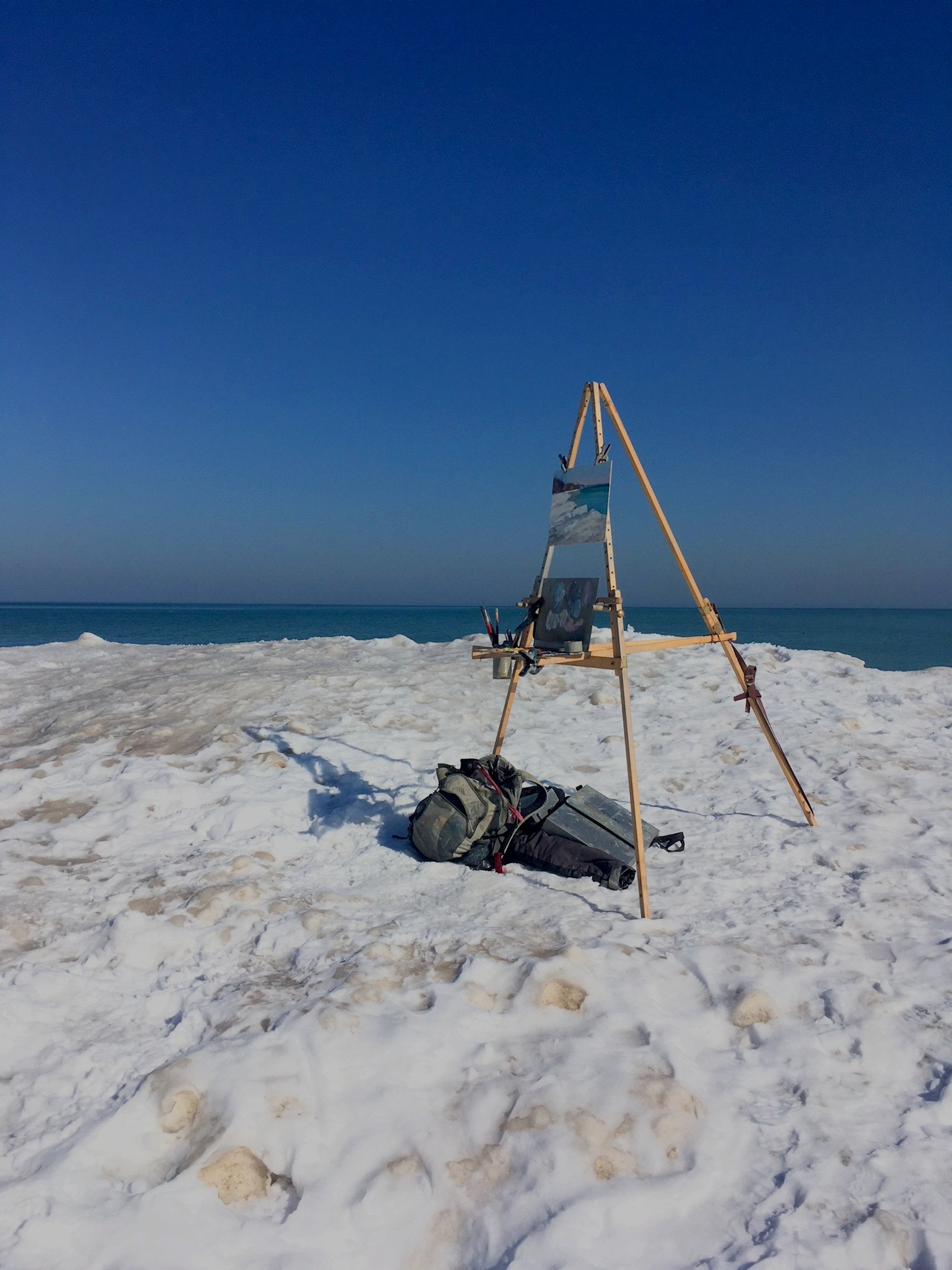 The Nadeau Easel set up on an iceberg, showing it's stability in windy outdoor painting conditions.